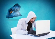 Hacker com luva usando um portátil na frente do fundo azul imagens de stock Hacker com luva usando um portátil na frente do fundo azul imagens de stock