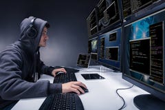 Hacker Using Multiple Computers For Stealing Data royalty free stock photo Hacker Using Multiple Computers For Stealing Data royalty free stock photo