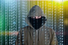 Hackers programmer look on screen and writes the program code hack information and user account royalty free stock images Hackers programmer look on screen and writes the program code hack information and user account royalty free stock images