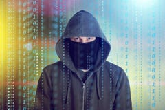 Hackers programmer look on screen and writes the program code hack information and user account stock photo Hackers programmer look on screen and writes the program code hack information and user account stock photo