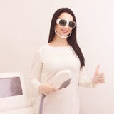 Hair laser removal service. IPL cosmetology device. Professional apparatus. Woman soft skin care stock image Hair laser removal service. IPL cosmetology device. Professional apparatus. Woman soft skin care stock image