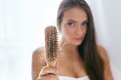 Hair Loss. Upset Woman Holding Brush With Hair