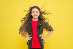 Hairdo for her face shape. Happy girl enjoying her new hairdo on yellow background. Little child with cute smile and royalty free stock photo Hairdo for her face shape. Happy girl enjoying her new hairdo on yellow background. Little child with cute smile and royalty free stock photo