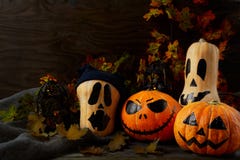 Halloween decorated pumpkins on dark rustic background, copy spa royalty free stock photo Halloween decorated pumpkins on dark rustic background, copy spa royalty free stock photo