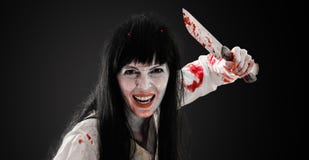 Crazy bloody scary zombie girl with butcher cleaver stock image Crazy bloody scary zombie girl with butcher cleaver stock image