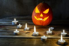 Halloween jack-o-lantern and burning candles stock image Halloween jack-o-lantern and burning candles stock image