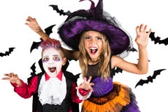 Halloween-Kinder, glückliches furchtsames Mädchen und Junge kleideten oben in Halloween-Kostümen der Hexe, des Zauberers und des lizenzfreies stockfoto Halloween-Kinder, glückliches furchtsames Mädchen und Junge kleideten oben in Halloween-Kostümen der Hexe, des Zauberers und des lizenzfreies stockfoto