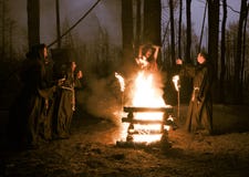 Halloween. Men in black clothes, burn the witch at the stake at Stock Image Halloween. Men in black clothes, burn the witch at the stake at Stock Image