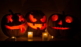 Halloween pumpkins with scary face and burning candle Stock Image Halloween pumpkins with scary face and burning candle Stock Image