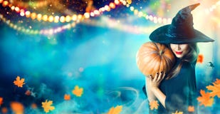 Halloween Witch With A Carved Pumpkin And Magic Lights Royalty Free Stock Images Halloween Witch With A Carved Pumpkin And Magic Lights Royalty Free Stock Images
