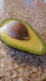 Halved Avocado with pit royalty free stock images Halved Avocado with pit royalty free stock images