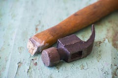 Hammer with a broken handle on a wooden background royalty free stock image Hammer with a broken handle on a wooden background royalty free stock image