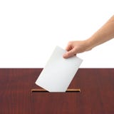 Hand with ballot and box