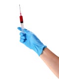 Hand in a blue glove holding syringe stock images Hand in a blue glove holding syringe stock images