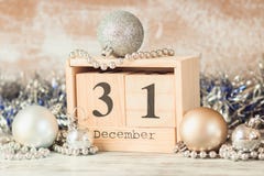 Hand changing wooden calendar with different New Year decorations royalty free stock images Hand changing wooden calendar with different New Year decorations royalty free stock images