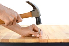 Hand hammering a nail Royalty Free Stock Images Hand hammering a nail Royalty Free Stock Images