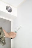 Man painting white wall, with roller stock photos Man painting white wall, with roller stock photos