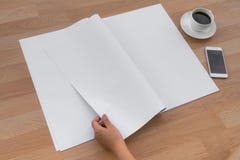 Hand hold Blank Newspaper with empty space mock up on wood background stock photos Hand hold Blank Newspaper with empty space mock up on wood background stock photos