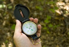 Hand Holding A Compass Royalty Free Stock Photography