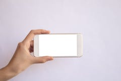 Hand holding mobile phone with isolated background. stock photo Hand holding mobile phone with isolated background. stock photo