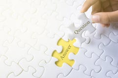 Hand holding question and answer word on jigsaw puzzle stock photography Hand holding question and answer word on jigsaw puzzle stock photography
