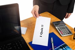 Hand holding resignation letter on the desk of the boss. royalty free stock photography Hand holding resignation letter on the desk of the boss. royalty free stock photography