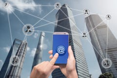 Hand holding smartphone and click on button with at sign linked. With people icons. Email marketing, newsletter and bulk mail concepts royalty free stock photo Hand holding smartphone and click on button with at sign linked. With people icons. Email marketing, newsletter and bulk mail concepts royalty free stock photo