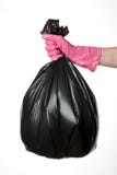 Hand holding trash bag stock photos Hand holding trash bag stock photos