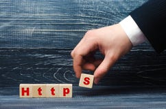Hand holds a cube with the letter S with the word http. Changing the protocol for security and transfer of hypervistext, increasin stock image Hand holds a cube with the letter S with the word http. Changing the protocol for security and transfer of hypervistext, increasin stock image
