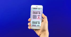 Hand holds smartphone with health passport app, concept of digital application with COVID-19 test results, isolated blue