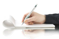 Hand Keep Pen And Writing On The Notebook Royalty Free Stock Image