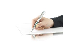 Hand Keep Pen And Writing On The Page Royalty Free Stock Photography