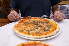 Man eating pizza on terrace royalty free stock photos Man eating pizza on terrace royalty free stock photos