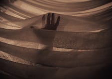 Hand in the Light touching fabric royalty free stock photography Hand in the Light touching fabric royalty free stock photography
