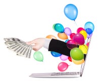 Hand met geld en laptop stock afbeelding Hand met geld en laptop stock afbeelding