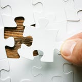 Hand with missing jigsaw puzzle piece. Business concept image for completing the final puzzle piece. stock photos Hand with missing jigsaw puzzle piece. Business concept image for completing the final puzzle piece. stock photos