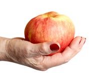 Hand Of The Elderly Lady Holding An Apple Royalty Free Stock Photography Hand Of The Elderly Lady Holding An Apple Royalty Free Stock Photography