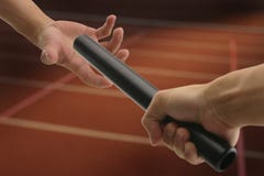 Hand passing baton royalty free stock photography Hand passing baton royalty free stock photography