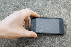 Hand Pick Up The Mobile Phone With Broken Display Stock Image Hand Pick Up The Mobile Phone With Broken Display Stock Image