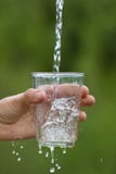 Hand pouring clean natural water royalty free stock images Hand pouring clean natural water royalty free stock images