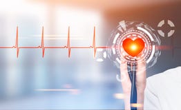 Hand with a stethoscope, heart HUD royalty free stock photo Hand with a stethoscope, heart HUD royalty free stock photo