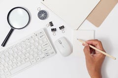 Hand use pencil writing on white paper note and business objects Stock Image Hand use pencil writing on white paper note and business objects Stock Image