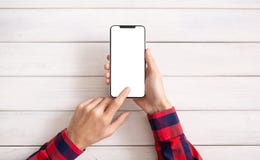 Hand using smartphone on white wooden background royalty free stock images Hand using smartphone on white wooden background royalty free stock images