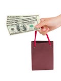 Hand With Money Shopping Bag Stock Image