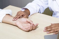 Hand woman professional doctor take the pulse with patient at hospital stock image Hand woman professional doctor take the pulse with patient at hospital stock image