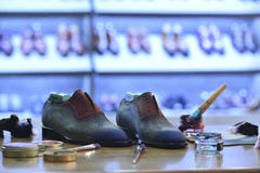 Handmade colorful luxury man shoes are hand-painted in a production factory. stock image Handmade colorful luxury man shoes are hand-painted in a production factory. stock image