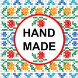 Handmade round frame over a colored cross stitch pattern royalty free illustration Handmade round frame over a colored cross stitch pattern royalty free illustration