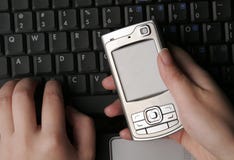Hands And Mobile Phone On Lapt Stock Photography Hands And Mobile Phone On Lapt Stock Photography