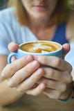 Hands around a cup of coffee Hands around a cup of coffee