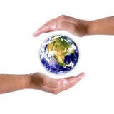 Hands around earth globe - nature and environment